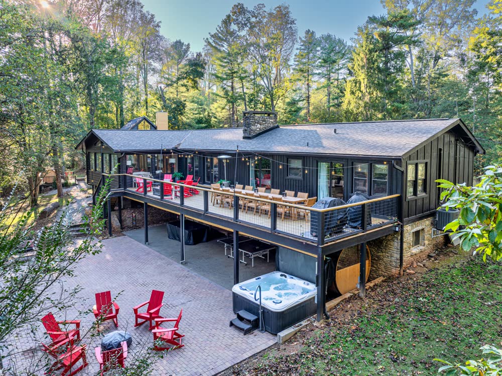 The Ridgetop Lodge deck with hot tub and red Adirondack chairs, Asheville NC